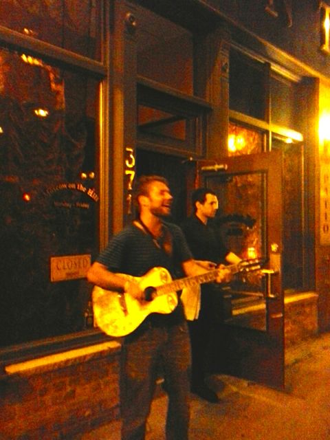 Luke in Street Playing Guitar