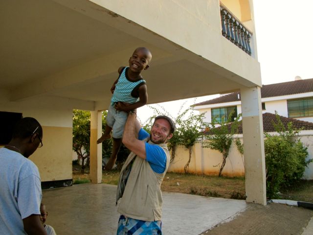 Lifting boy in Luna Home in Kenya